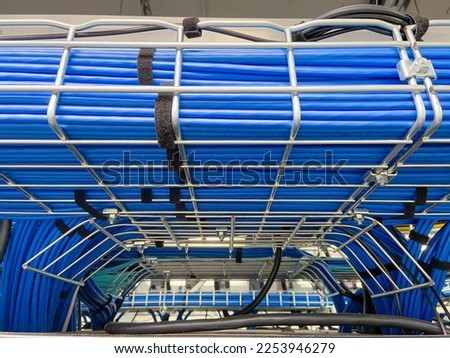 Copper cable infrastructure mounted on the metal wired trays Royalty-Free Stock Photo #2253946279