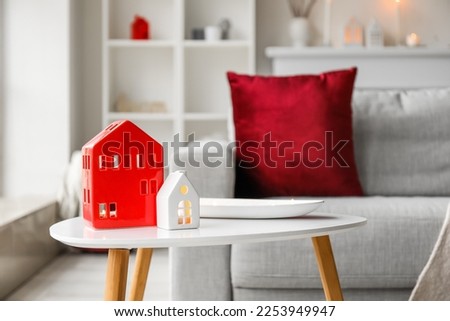House candle holders on table in living room, closeup
