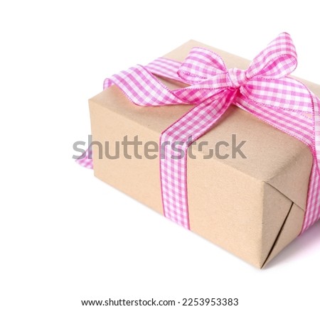 Gift box with checkered bow for Valentine's Day on white background