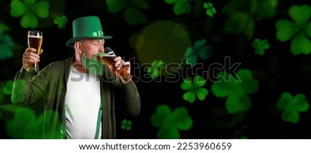 Mature man drinking beer on dark background. Banner for St. Patrick's Day 