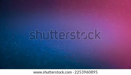 Neon light flare. Bokeh glow overlay. Fluorescent radiance. Defocused blue magenta pink color gradient sparkles on bright abstract copy space background.