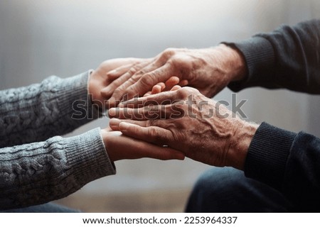 Closeup of hands of old man and a young female hands. Senior man, with caregiver indoors. Concept of health caring for elderly old people, disabled. Royalty-Free Stock Photo #2253964337
