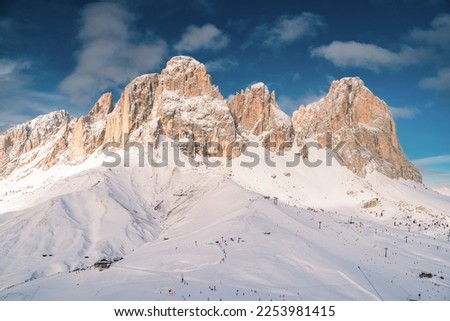 Sunny view of ski slope at Col Rodella valley near Canazei of Val di Fassa, Trentino-Alto-Adige region, Italy. Royalty-Free Stock Photo #2253981415