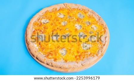 Four seasons Pizza isolated on blue background