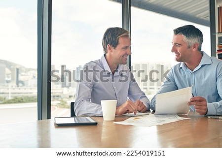 Business meeting, team and talking about documents, corporate planning and strategy. Men, partner or manager together for finance collaboration with paperwork during happy office conversation