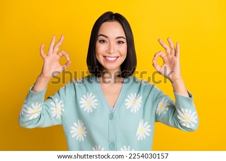 Photo of lovely positive lady wear trendy clothes arm demonstrate okey symbol good choice offer isolated on yellow color background