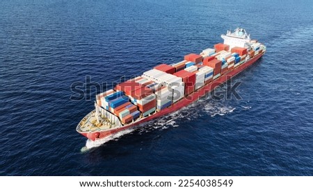 Aerial drone photo of huge fully loaded container truck size tanker ship cruising deep blue sea Royalty-Free Stock Photo #2254038549