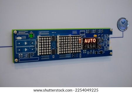 Printed circuit board - pcb for elevator with digital display module at lift exhibition, trade show - close up view. Technology and electronic concept