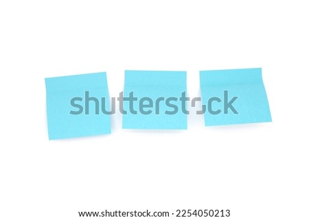 Three blue blank sticky notes on white background. Front view. Royalty-Free Stock Photo #2254050213
