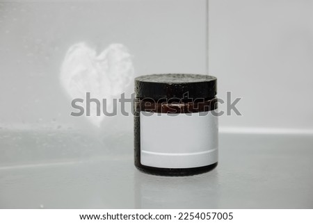 Dark color glass cosmetic. Cosmetic product for skin care.