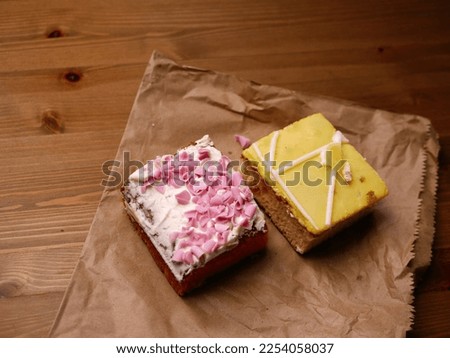 Decorated homemade cake with icing and pink sprinkles medium shot selective focus