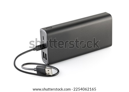 Additional self-contained external battery for charging mobile and other device. Power bank isolated on white background. Stylish charger (rechargeable battery) . Full depth of field.