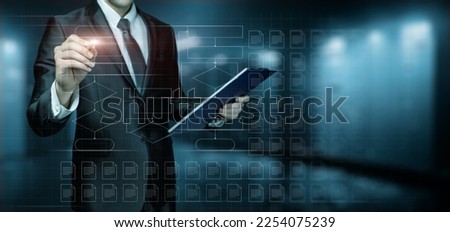 Businessman draw flowchart using electronic documents on virtual computer screen.