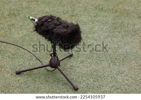 microphone on the ground football field