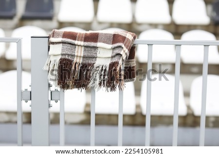 a blanket covered the tribune