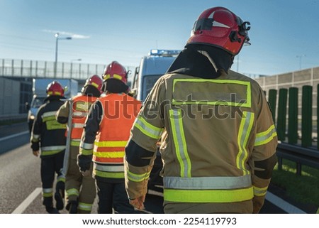 Four firefighters going to help someone