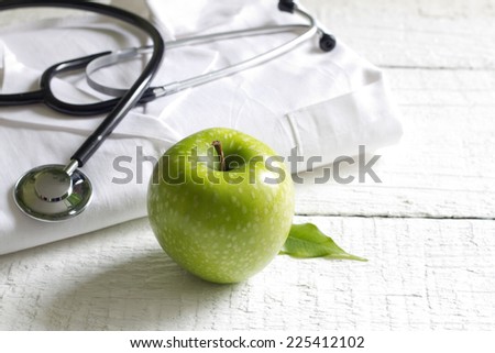 Alternative medicine apple and stethoscope concept