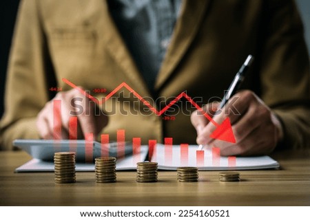 Economic crisis concept, businessman with falling financial graph chart due to global recession. Stock market crash, inflation, financial crisis, Falling income in GDP, capital reduction Royalty-Free Stock Photo #2254160521
