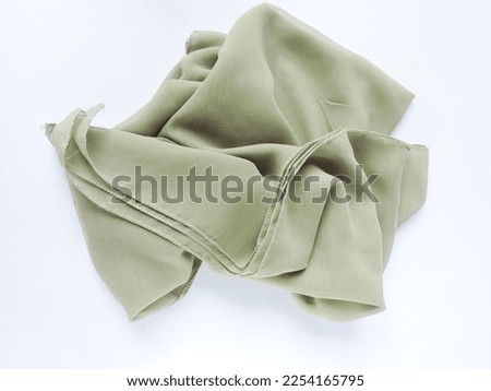 flat lay photography of green hijab or scarf. Women hijab. 