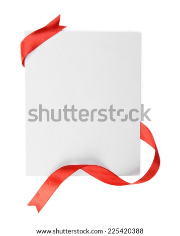 Shiny red ribbon with card isolated on white
