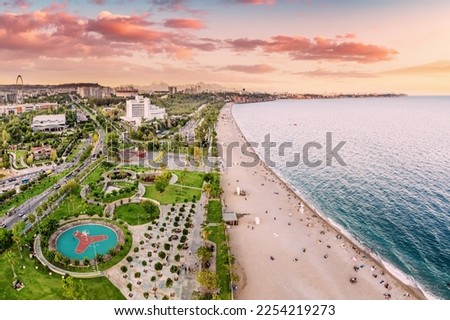 Aerial view of a beach park with vacationers in Antalya, Turkiye. Mediterranean sea coast and riviera. Royalty-Free Stock Photo #2254219273