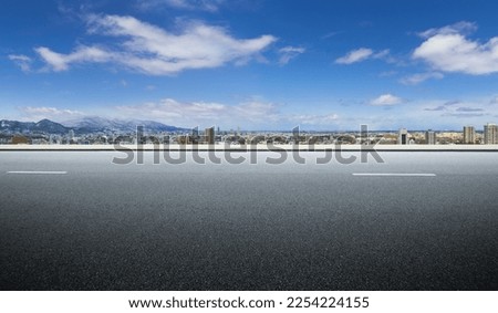 Panoramic side view asphalt road cityscape background Royalty-Free Stock Photo #2254224155