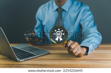 close up magnifier glass with Businessman using Laptop Computer with Webinar E-business Browsing Connection, online technology webcast, online education with certification or diploma, Communication.  Royalty-Free Stock Photo #2254226645
