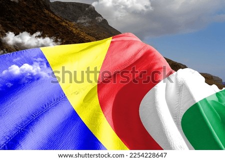  Seychelles national flag cloth fabric waving on beautiful mountain background.