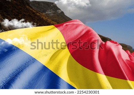Romania  national flag cloth fabric waving on beautiful mountain background.
