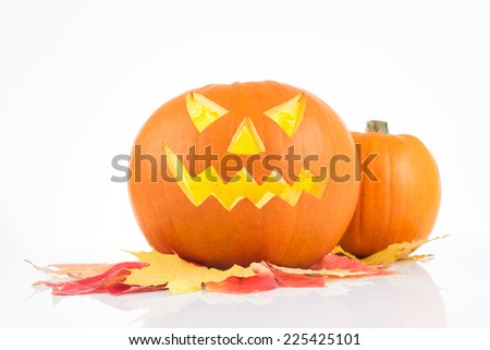 Halloween Pumpkin on autumn leaves, isolated on white