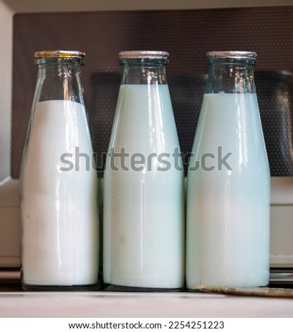 Old Soviet bottles for dairy products. Royalty-Free Stock Photo #2254251223