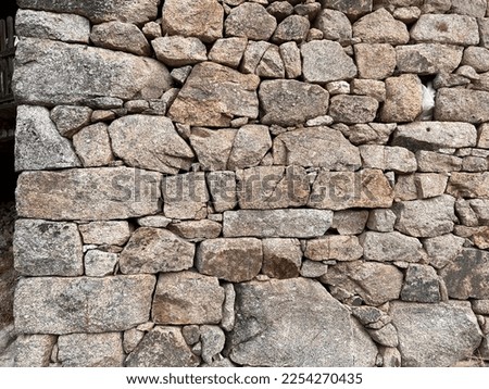 Detail of a traditional dry stone masonry from the south of France in the Cevennes Royalty-Free Stock Photo #2254270435