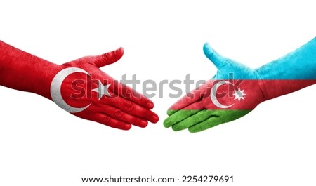 Handshake between Azerbaijan and Turkey flags painted on hands, isolated transparent image.