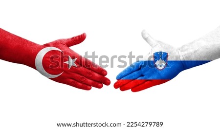 Handshake between Slovenia and Turkey flags painted on hands, isolated transparent image.