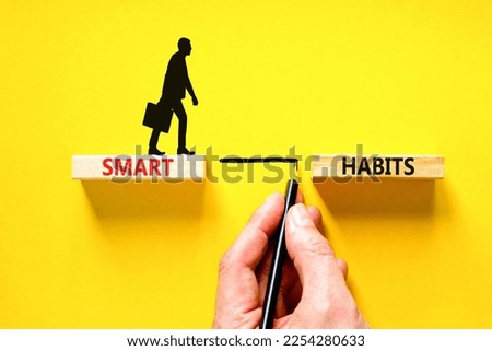 Smart habits symbol. Concept words Smart habits on wooden blocks. Beautiful yellow table yellow background. Businessman hand. Businessman icon. Business and smart habits concept. Copy space.