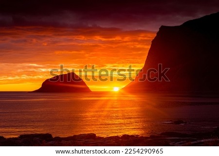 Incredible midnight sunset over the sea of Vik beach, Lofoten Islands, Norway Royalty-Free Stock Photo #2254290965