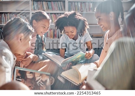Education, books or students reading in a library for group learning development or growth. Storytelling, kids or happy children talking together for knowledge on funny fantasy stories at school