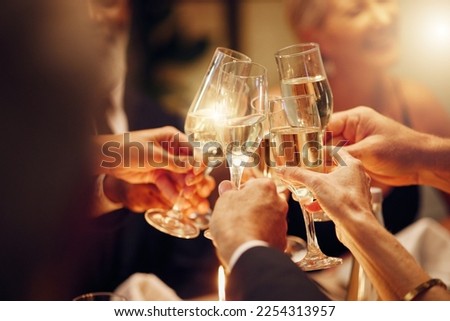 Success, hands or toast in a party for goals, winning deal or new year at luxury social event celebration. Motivation, team work or people cheers with champagne drinks or wine glasses at dinner gala Royalty-Free Stock Photo #2254313957