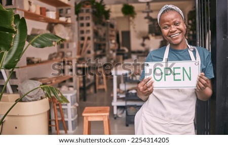 Creative startup, small business and black woman with open sign for art class, workshop and pottery store. Smile, entrepreneur and girl happy for welcome to ceramic, clay sculpture and retail artwork