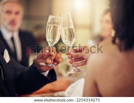 Success, hands or champagne toast in a party in celebration of goals, achievement or new year at luxury event. Motivation, congratulations or friends cheers with drinks or wine glasses at dinner gala Royalty-Free Stock Photo #2254314275