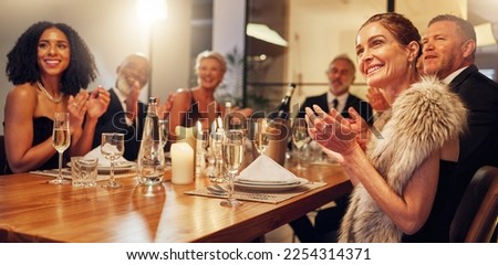 People, restaurant and clapping at celebration in night for friends, business executive team or happy for success. New year, applause or gala party with champagne, congratulations or group motivation Royalty-Free Stock Photo #2254314371