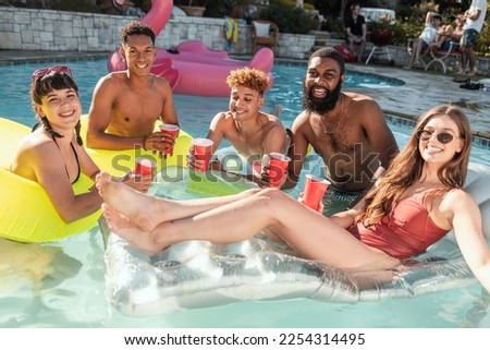 Friends selfie, beer and pool party, having fun and partying on new year. Summer celebration, water event and group portrait of people taking pictures for social media, swimming or floating on float.