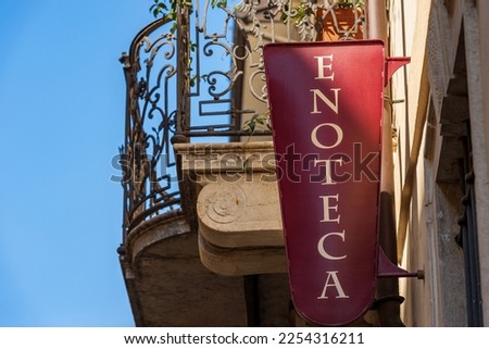 Close-up of a metal sign of an Italian wine shop (Enoteca in Italian language), Brescia downtown, Lombardy, Italy, southern Europe.