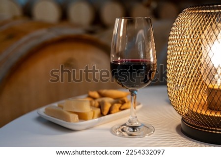 Tasting of variety of rioja wines, visit of winery cellars with french or american oak barrels with agening red wine, Rioja wine making region, Spain Royalty-Free Stock Photo #2254332097