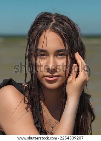 portrait of young asian woman with wet hair