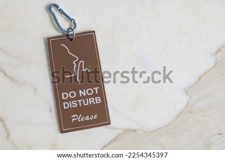 Do not disturb on the marble, flat lay image