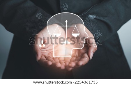 Business ethics Behavior and manners concept.  Businessman hold Ethics inside human mind integrity and moral symbols Company ethics culture, ESG. Royalty-Free Stock Photo #2254361735