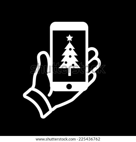 Vector smartphone in hand with christmas tree on screen icon | white flat design pictogram isolated on black background