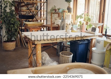 Creative, art and pottery with empty room of workshop for design, manufacturing and small business. Ceramics, interior and production with table in studio of for painting, inspiration and retail
