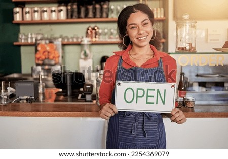 Small business, portrait or black woman with an open sign to welcome sales in cafe or coffee shop. Marketing, female manager or happy entrepreneur smiles while advertising or opening a retail store